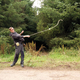 A slinging expert tests a replica sling (Image: John Reid via Current Archaeology)